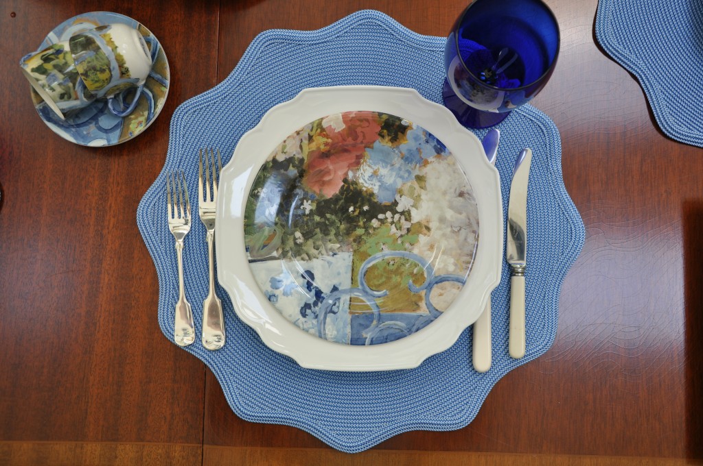 Closeup of Gien Chaise Bleue dessert plate on cream dinner plate.