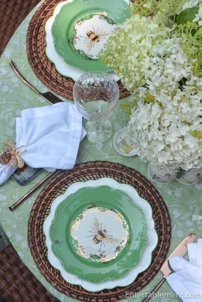 Anthropologie Nature Studies Bee salad plate featuring a detailed honeybee illustration with green border and delicate gilt decoration.