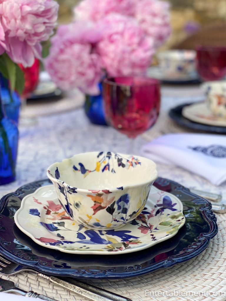 Individual place setting featuring Wildflower Studies dinnerware and coordinating floral napkin.