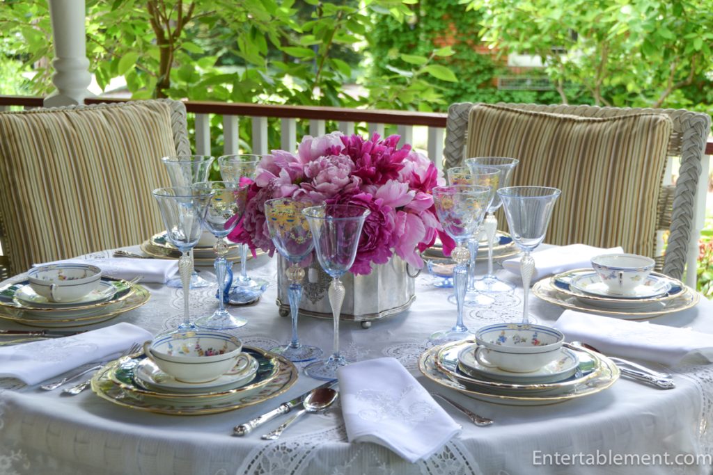 Table set on porch with lace cloth, vintage silver, powder blue china, and Venetian stemware.