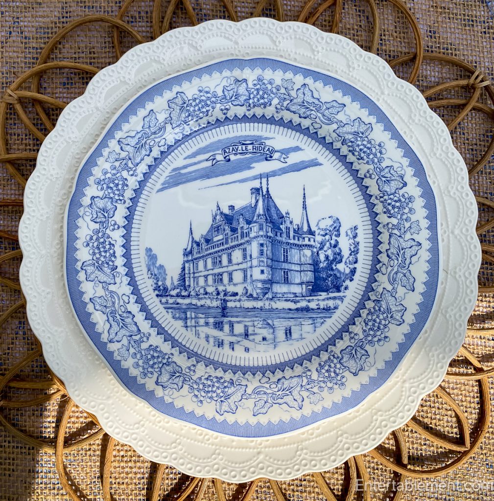 Delicate plate with a mirrored image of Château d’Azay-le-Rideau, bordered in vines.