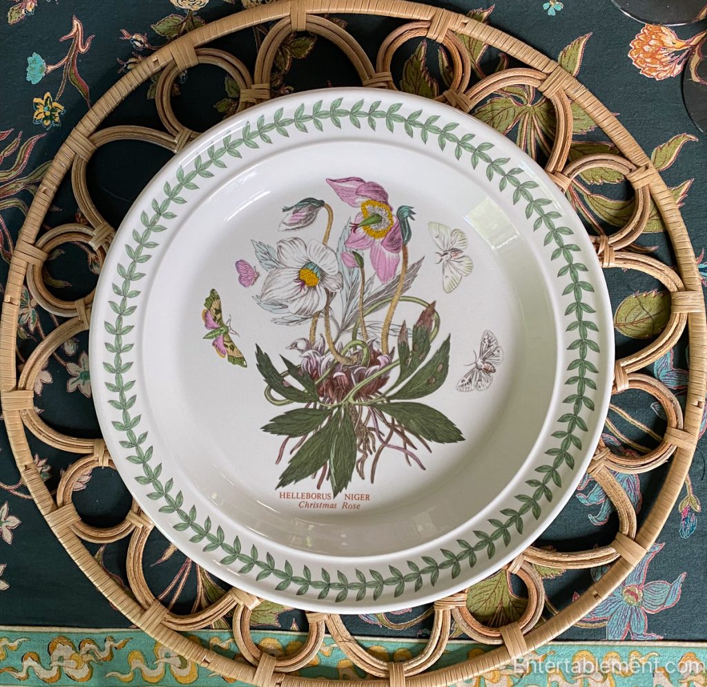 Portmeirion Botanic Garden plate featuring Helleborus Niger (Christmas Rose) with butterfly illustrations. 