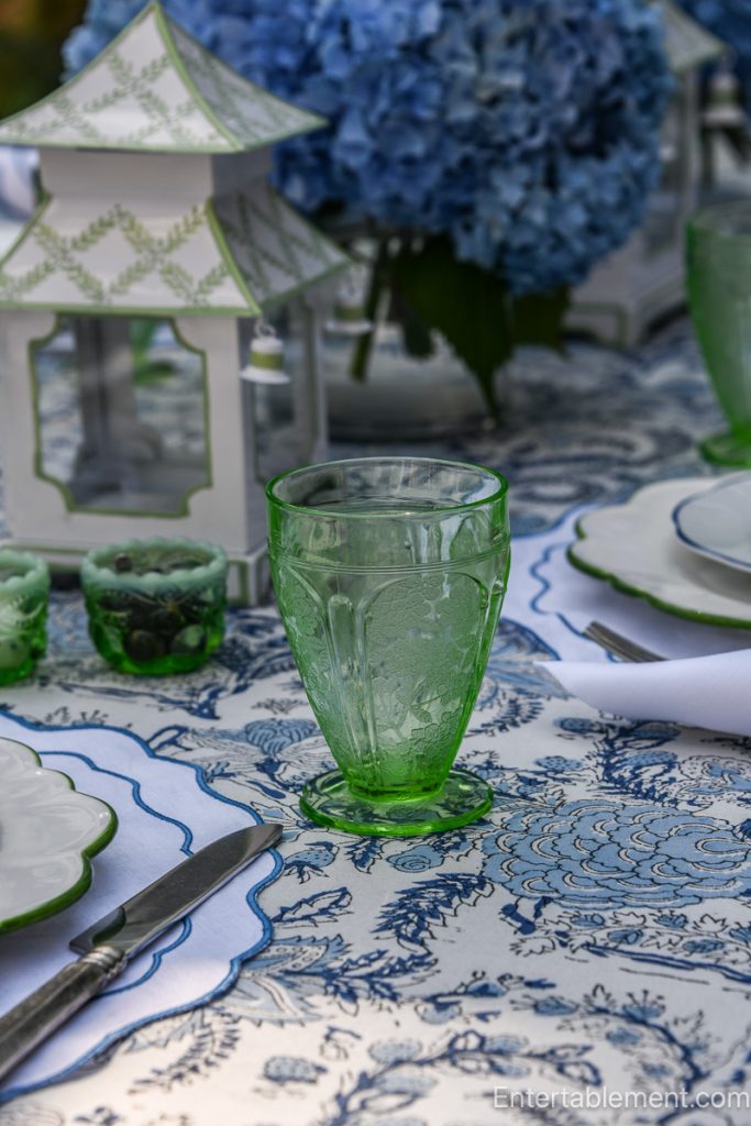 Green Depression glass by Jeanette in Cherry Blossom pattern.
