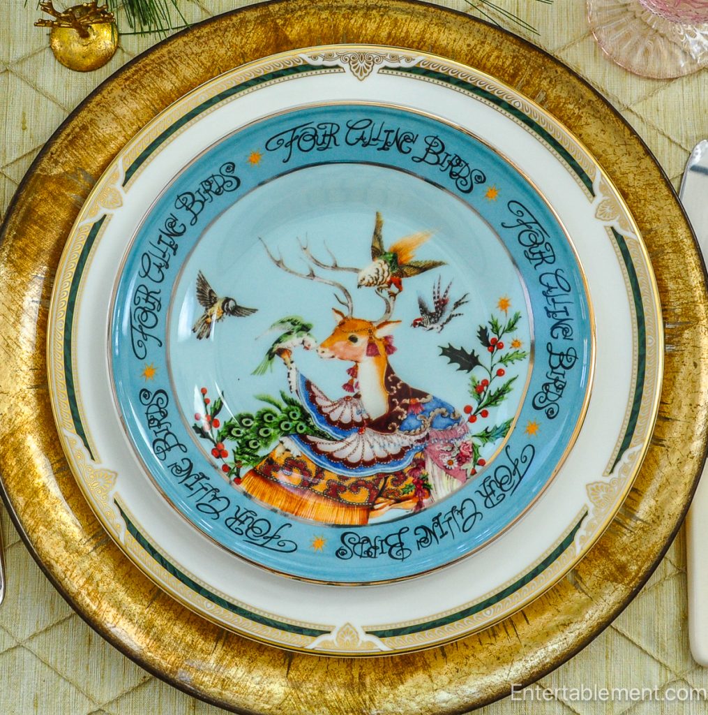 Anthropologie ‘Four Calling Birds’ plate in teal with ornate illustrated bird and garland border.