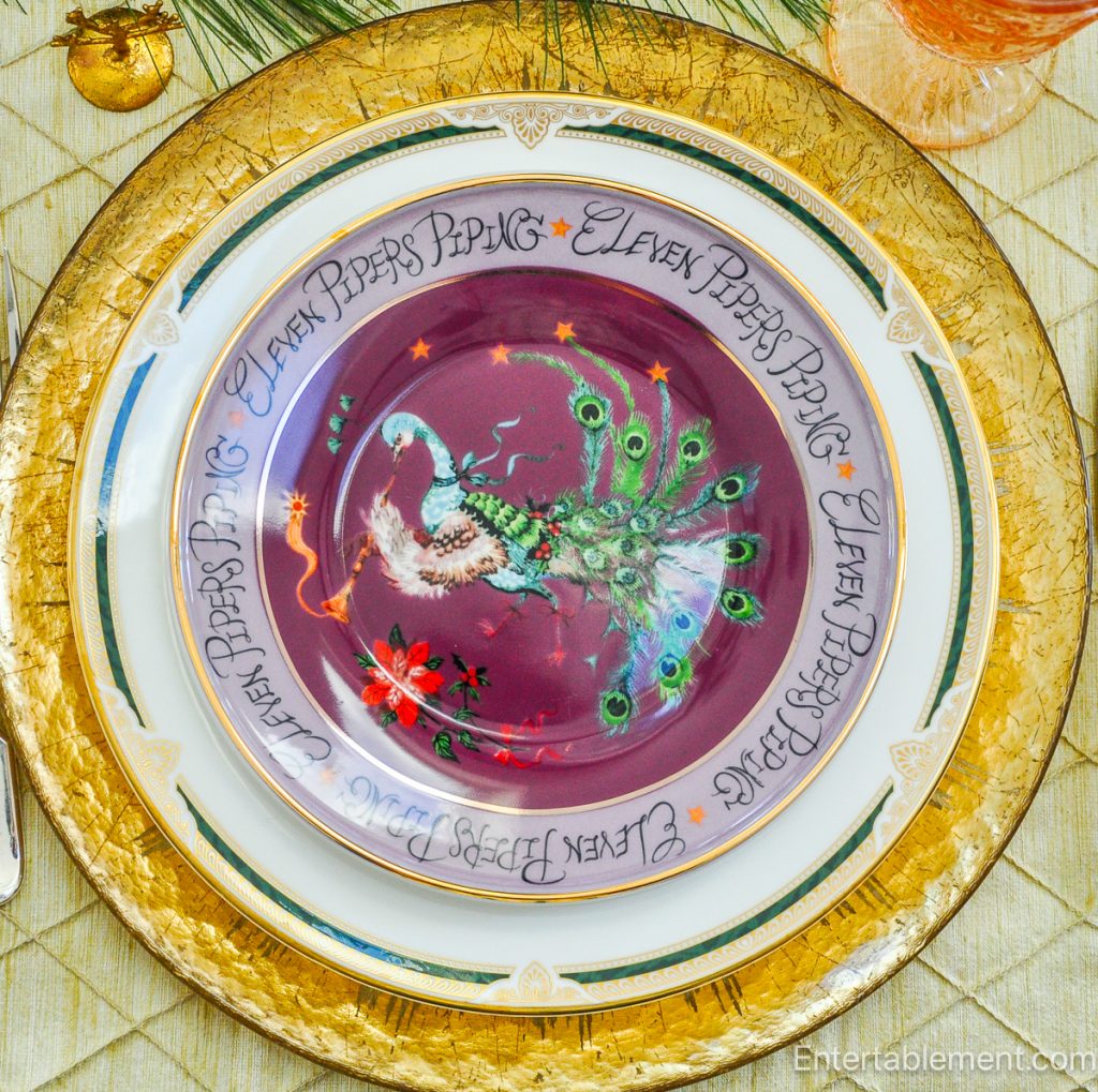 Anthropologie ‘Eleven Pipers Piping’ plate with illustrated piping character in purple tones.
