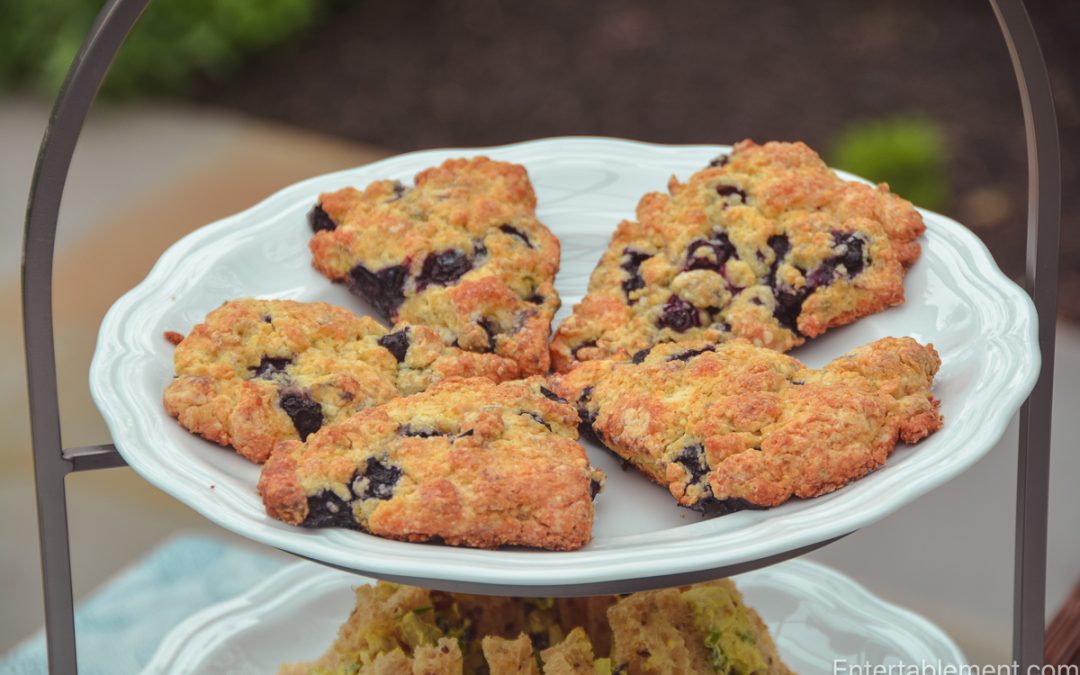 Fresh blueberry lemon scones served on a white platter for afternoon tea