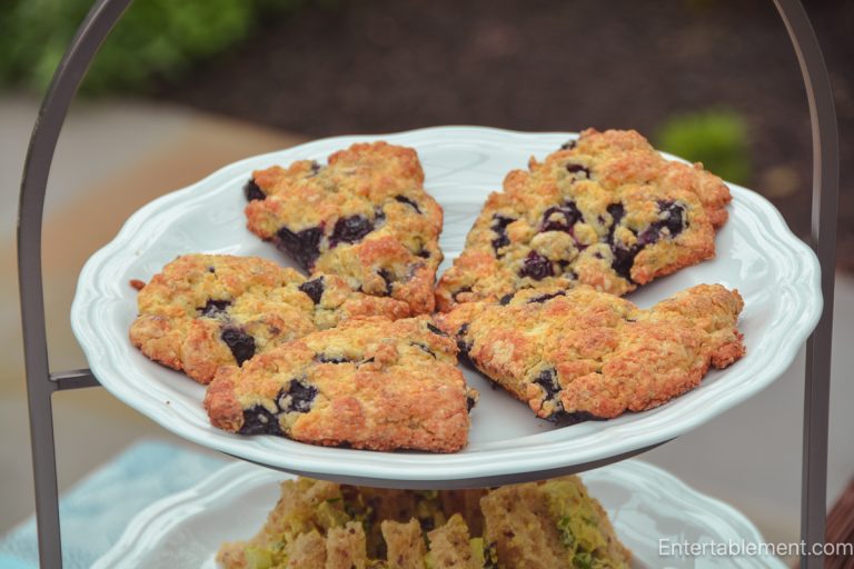 Fresh blueberry lemon scones served on a white platter for afternoon tea
