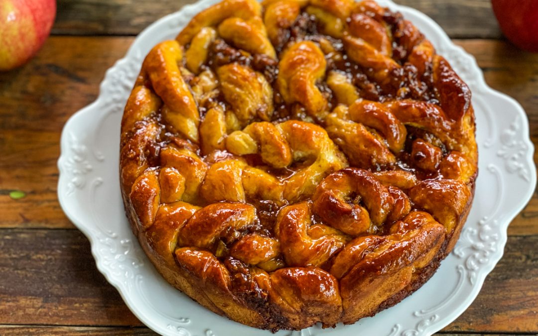 Close-up of Apple Pecan Sticky Bread with a shiny apple jelly glaze highlighting the twisted dough and caramelized apple pecan fillings.