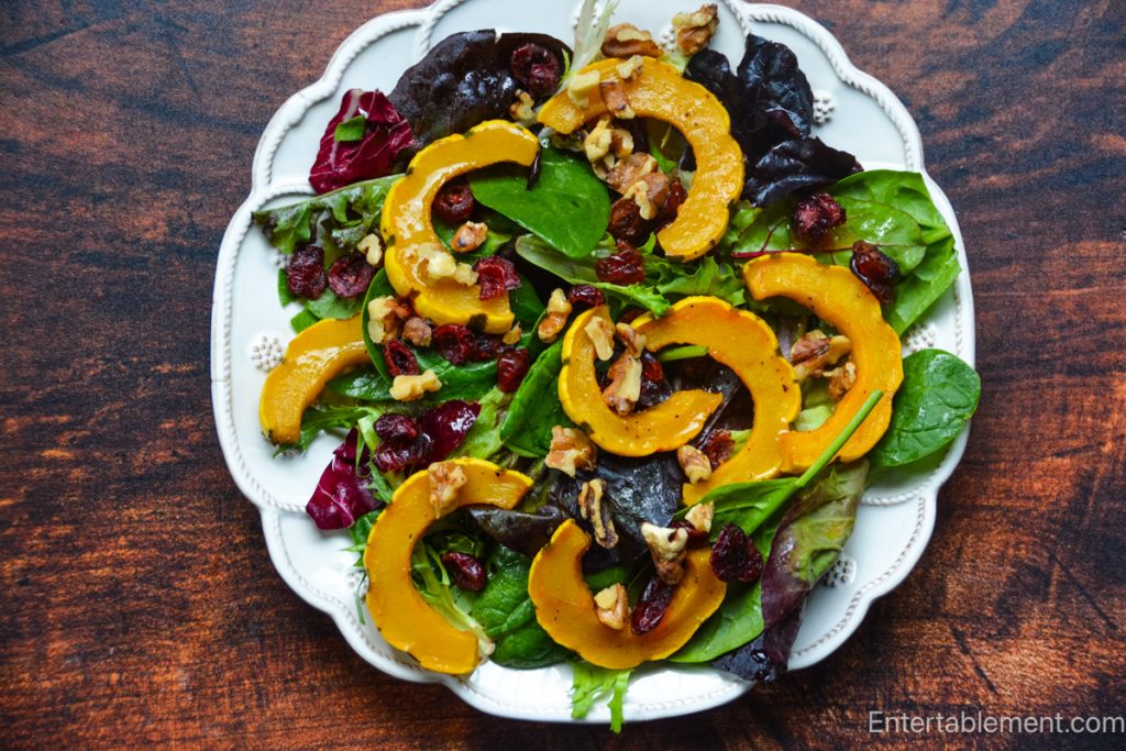Roasted Delicata squash salad with mixed greens, toasted walnuts and dried cranberries with a boiled cider-Dijon vinaigrette.