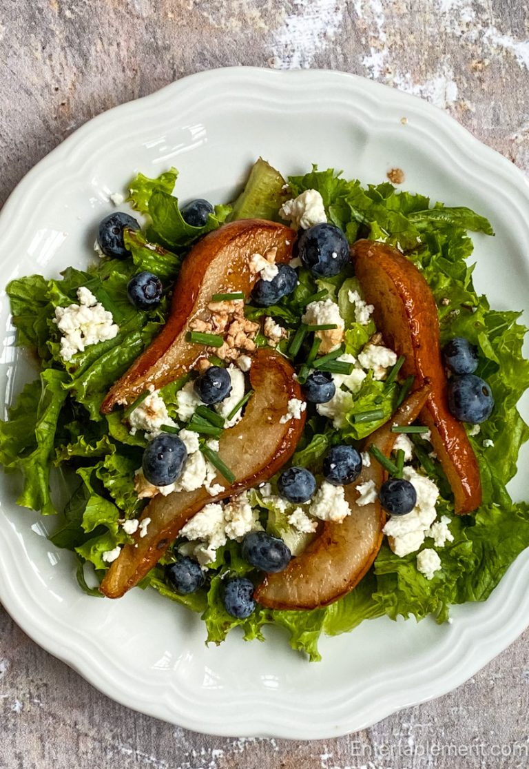 Sautéed pear and blueberry salad with crumbled feta and fresh chives over crisp greens, drizzled with fig vinaigrette.`