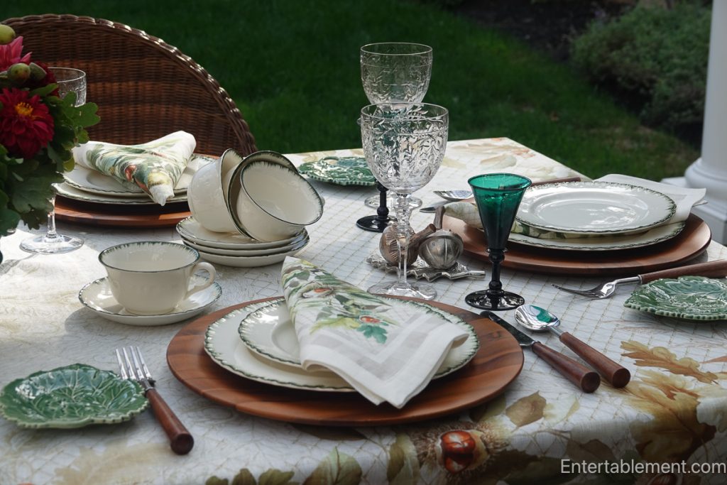 Late-summer table set with Wedgwood Williamsburg Green china, wooden chargers, green glassware and Chestnut linens.