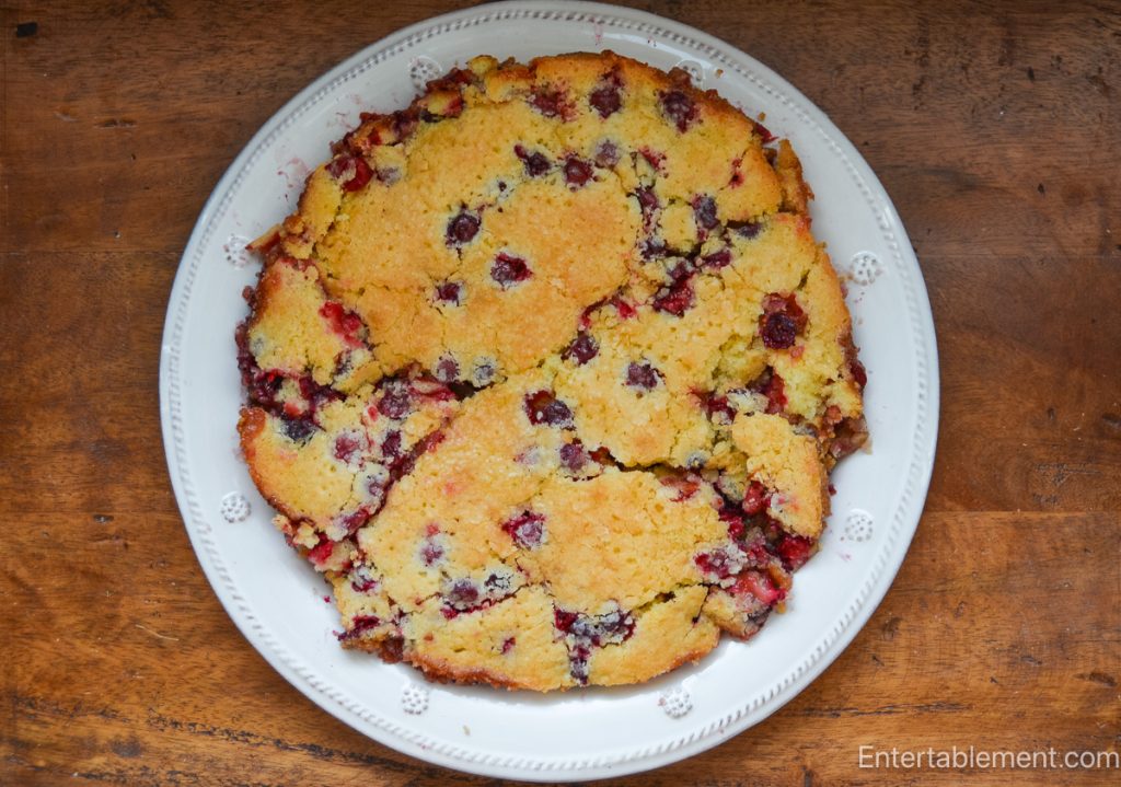 Cranberry walnut butter cake broken apart after the sticky cranberry layer adhered to the baking pan.