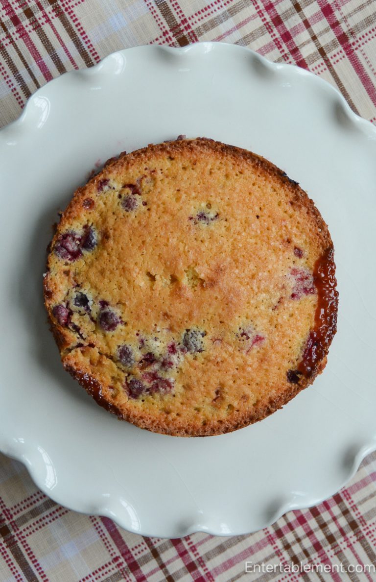 Whole Cape Cod Cranberry Walnut Butter Cake with golden buttery cake and fresh cranberries throughout.