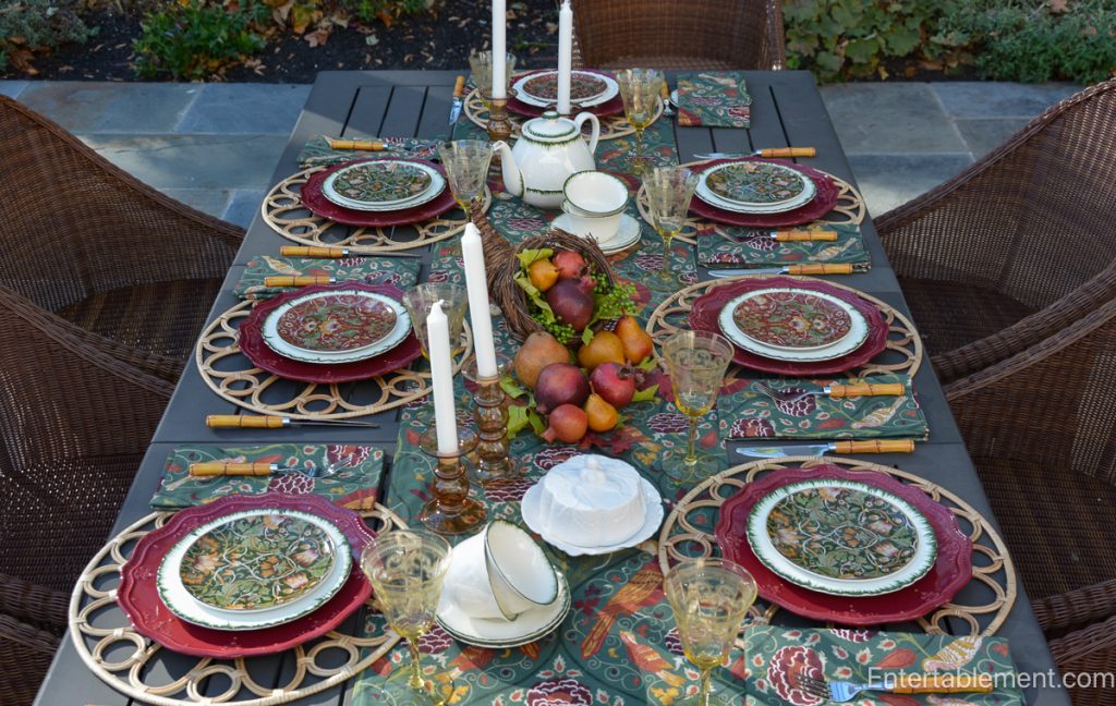 Morris & Co. Seasons by May runner with autumn fruit, amber glass and patterned china